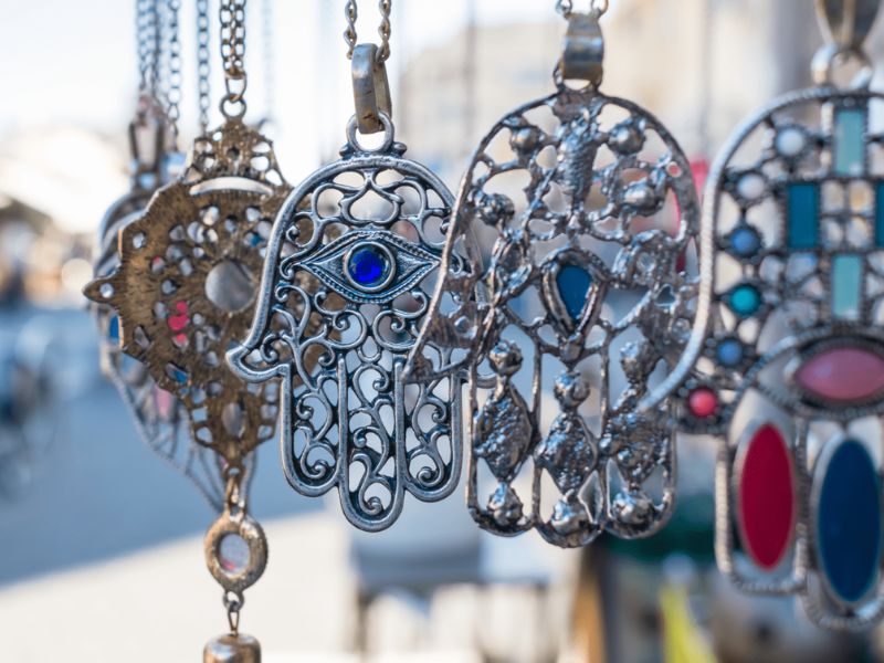Traditional Moroccan silver Khmissa pendants with intricate Berber engravings