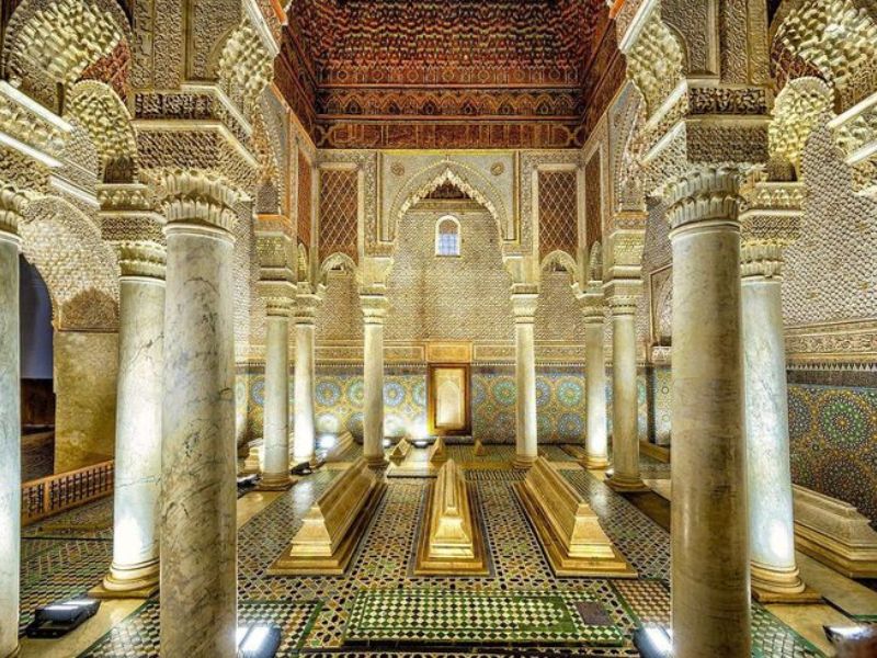 Interior view of the Saadian Tombs in Marrakesh, showcasing intricate Islamic architecture, elegant columns, and beautifully tiled floors with ornate details.